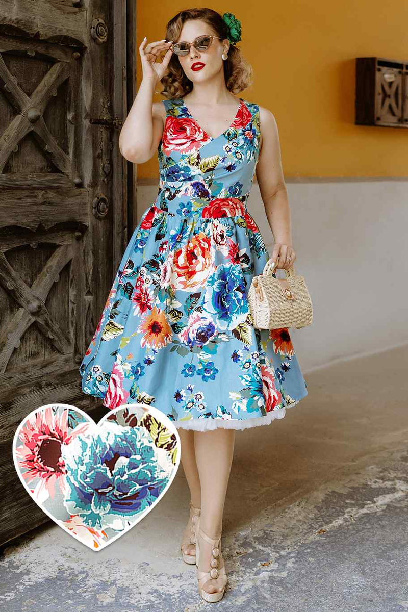 A model wearing a Crossover Bust Blue Floral Dress