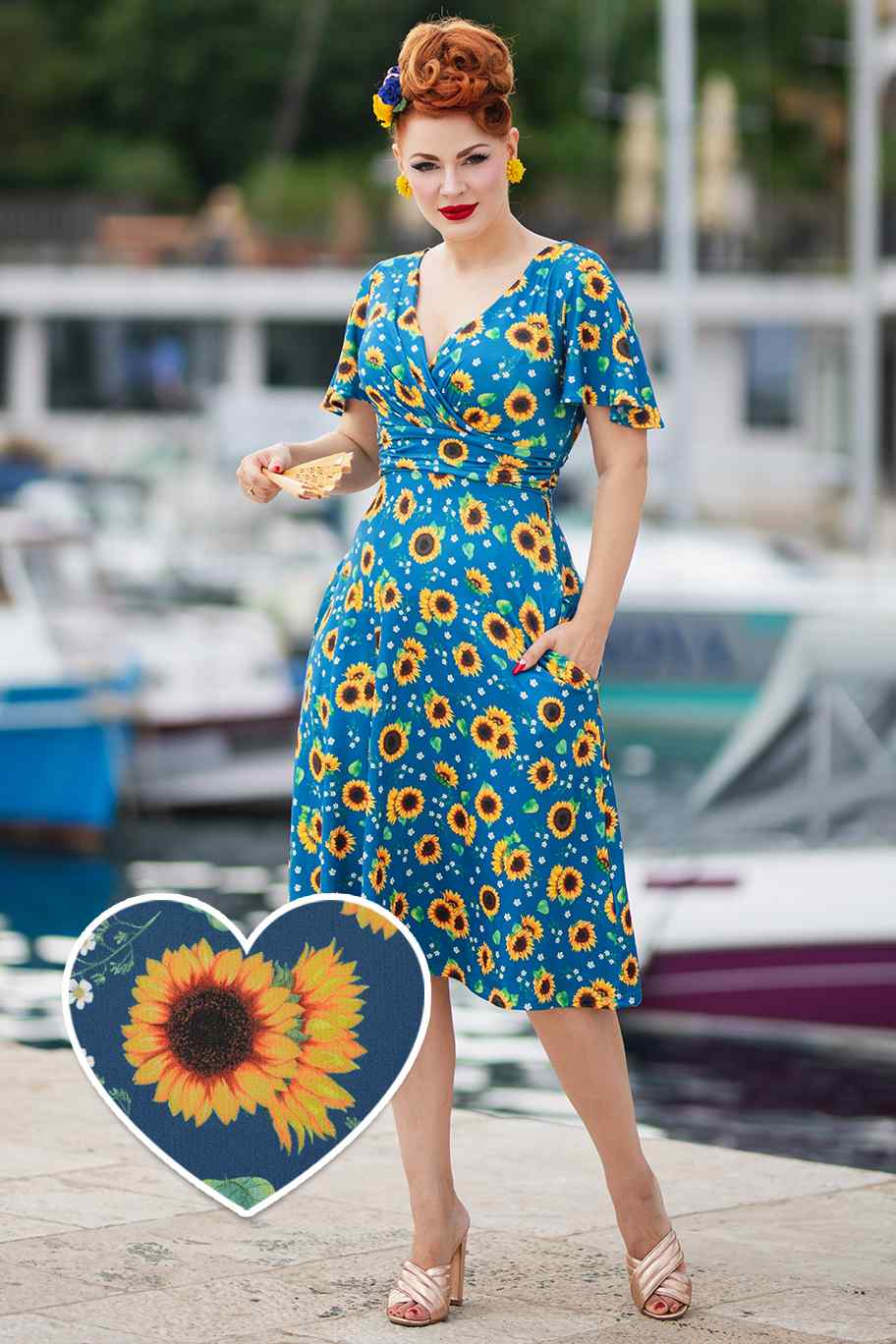 A model wearing a Crossover Bust Blue Sunflower Dress