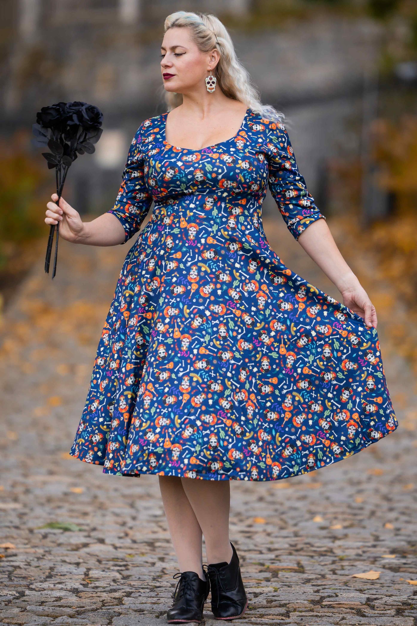 A lady wearing a Day Of The Dead Midi Dress