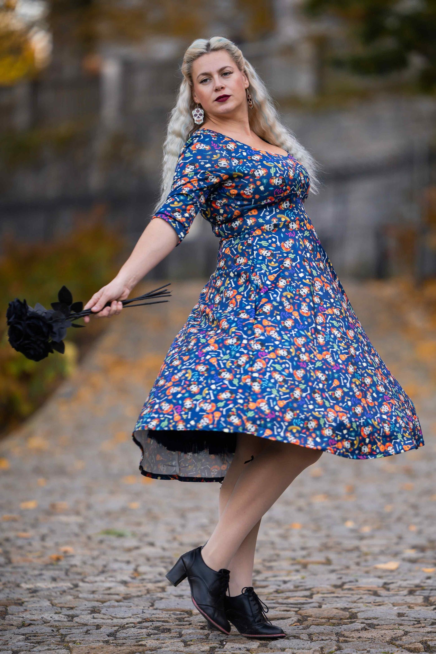 A lady wearing a Day Of The Dead Midi Dress