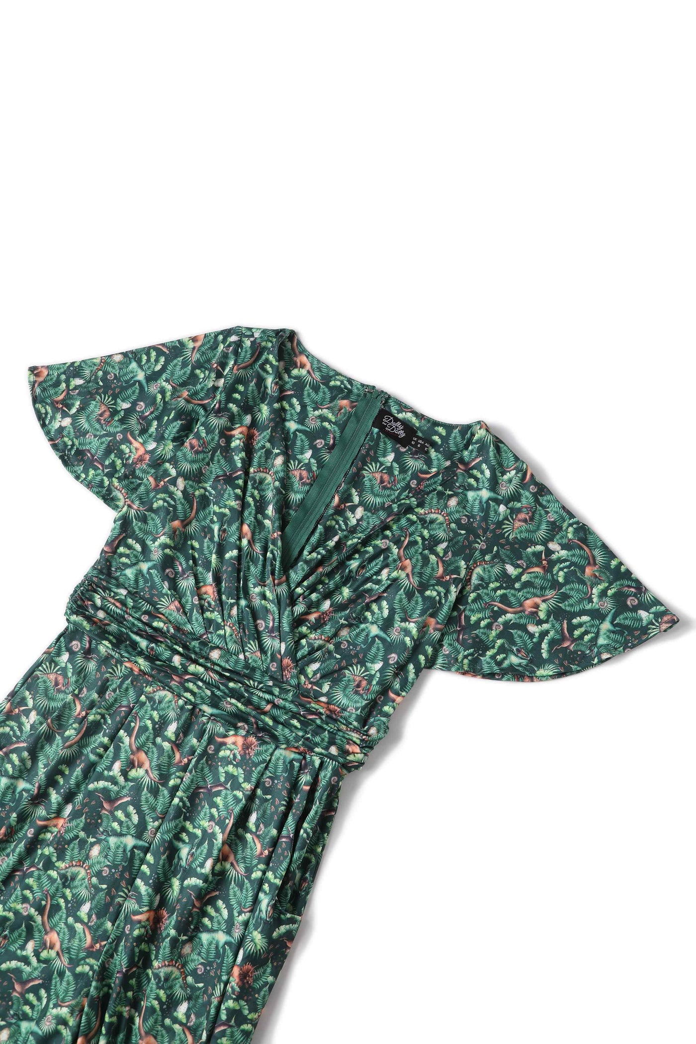 Close up view of Dinosaur Forest Jumpsuit In Green