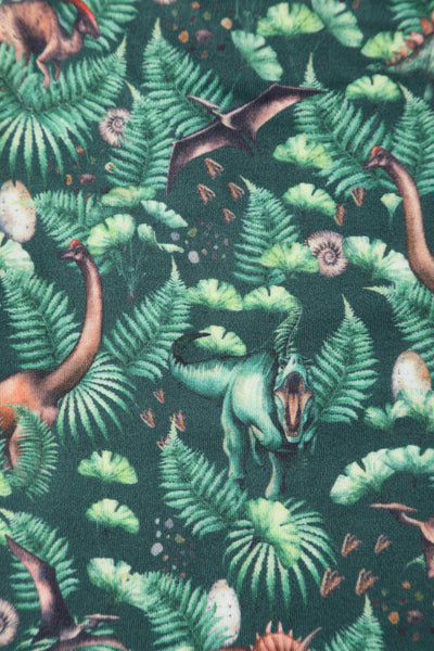 Close up view of Dinosaur Forest Jumpsuit In Green