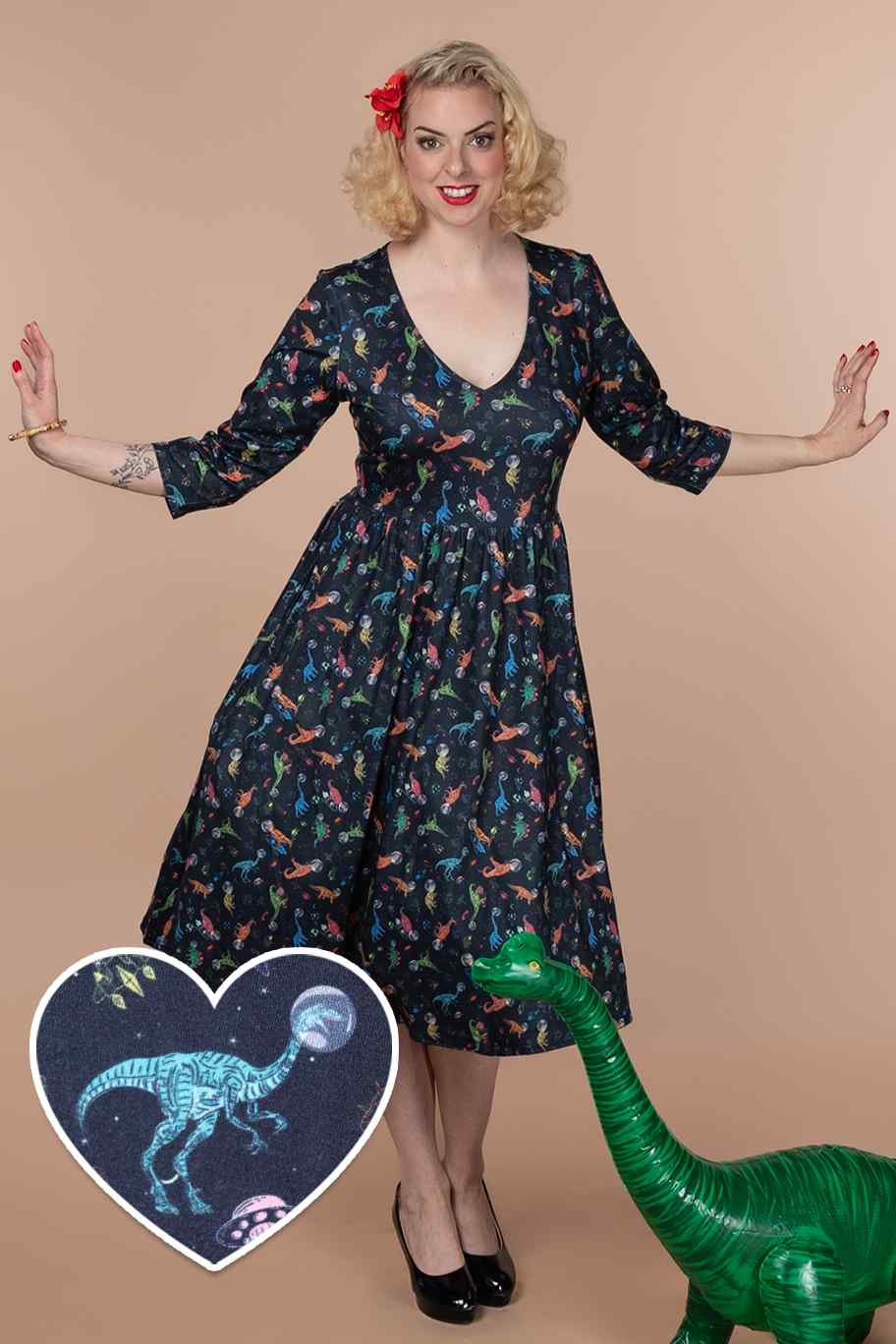 A lady wearing a Dinosaur In Space Long Sleeved Dress