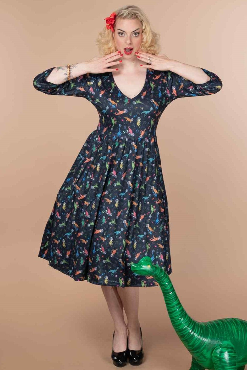 A lady wearing a Dinosaur In Space Long Sleeved Dress