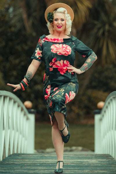 A model wearing a Fitted Off Shoulder Dress In Tiger Print