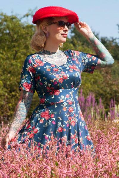 A model wearing a Floral Dragonfly Blue Dress