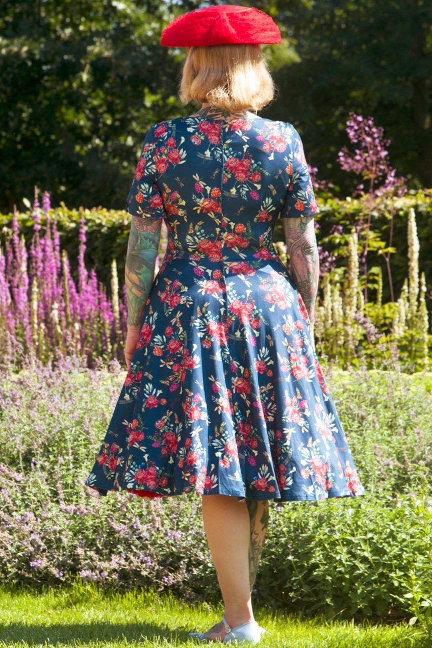 A model wearing a Floral Dragonfly Blue Dress