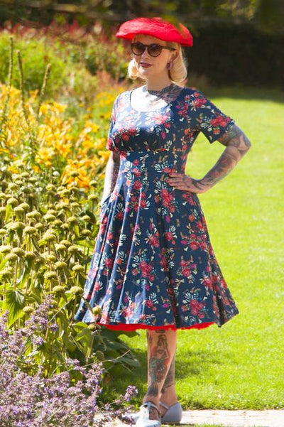 A model wearing a Floral Dragonfly Blue Dress