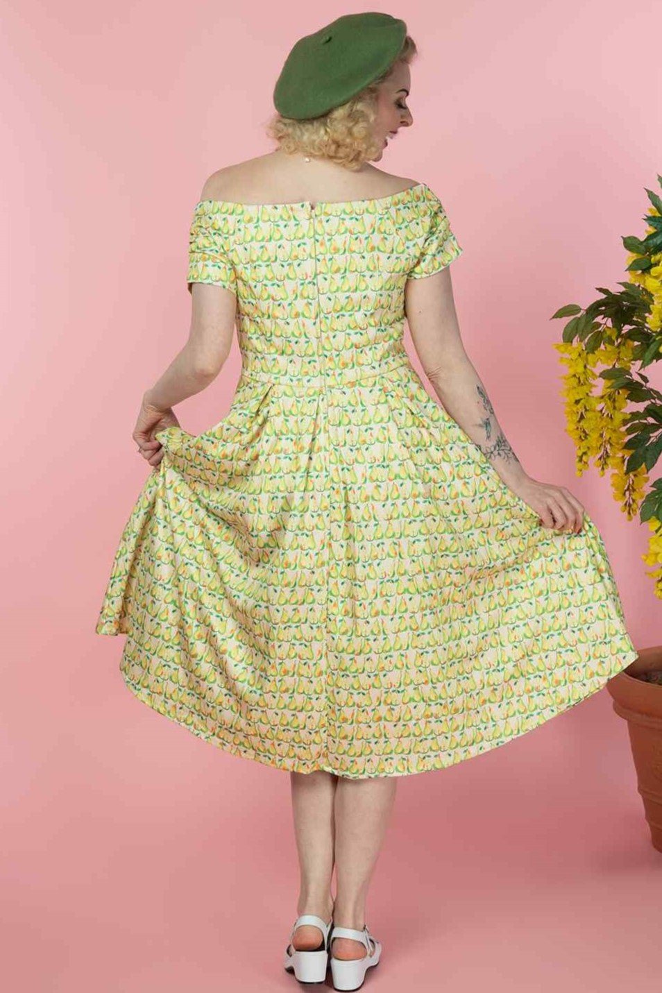 A lady wearing a Fruity Pear Off Shoulder Dress