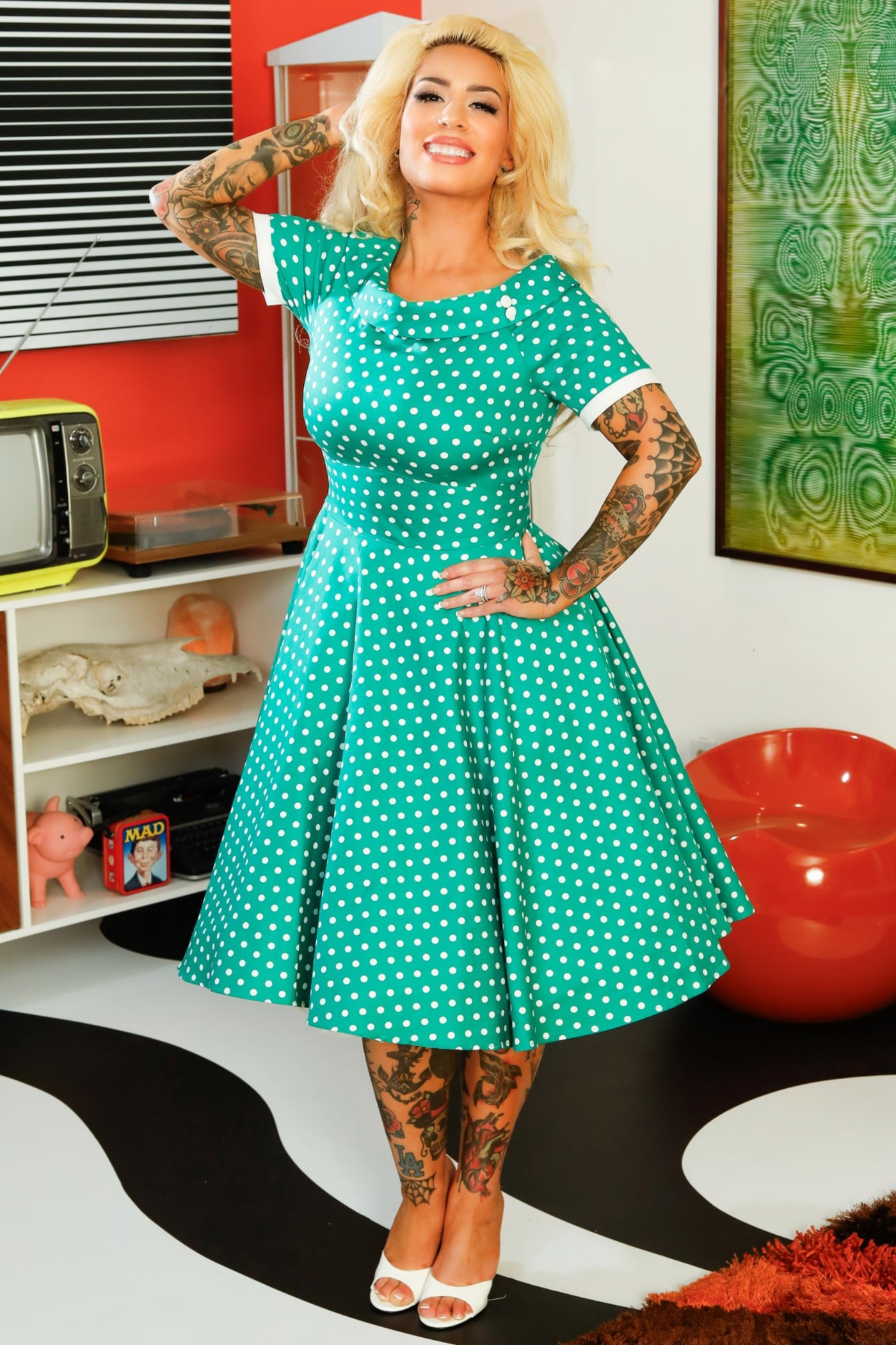 A model wearing a Full Circle Green Polka Dot Swing Dress