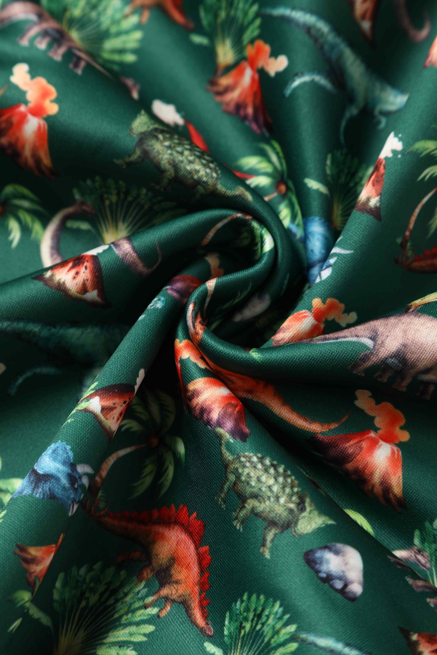 Close up view of Green Dinosaur & Volcano Swing Dress