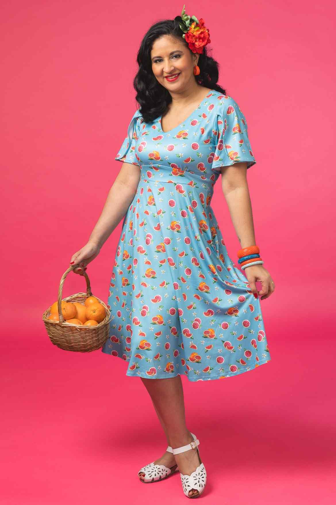 A model wearing a Green Grapefruit Petal Sleeved Tea Dress