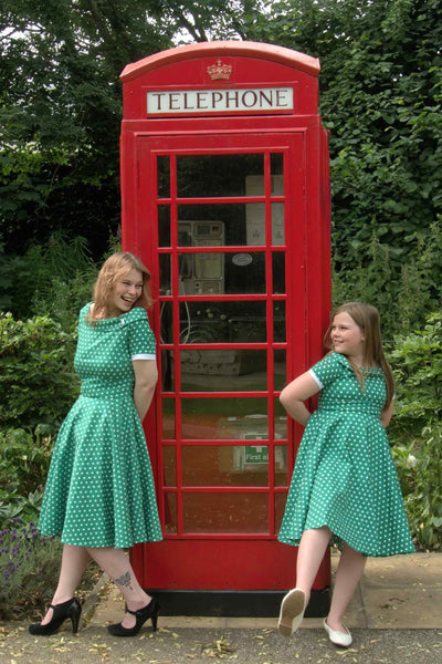 Mother and daughter wearing a Full Circle Green Polka Dot Swing Dress