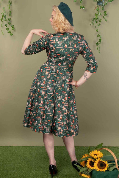 A model wearing a Green Woodland Dress