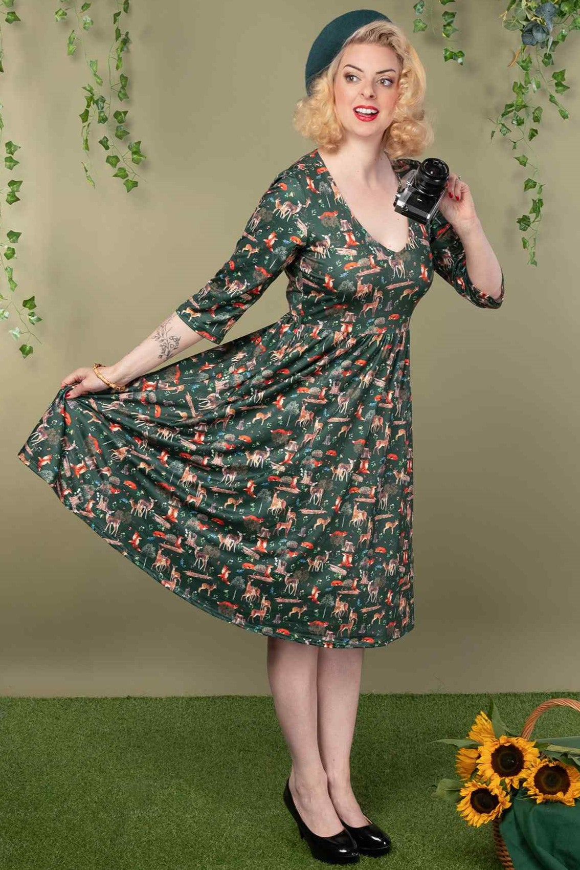 A model wearing a Green Woodland Dress