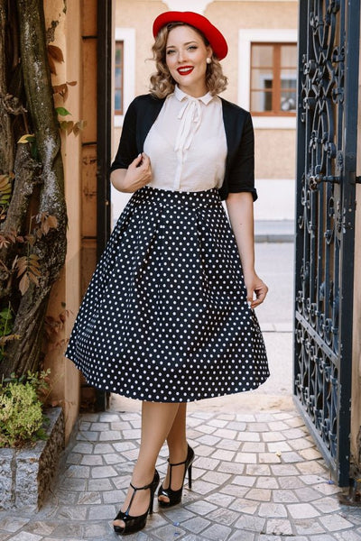 Model wearing a High Waist Polka Dot Skirt in Black