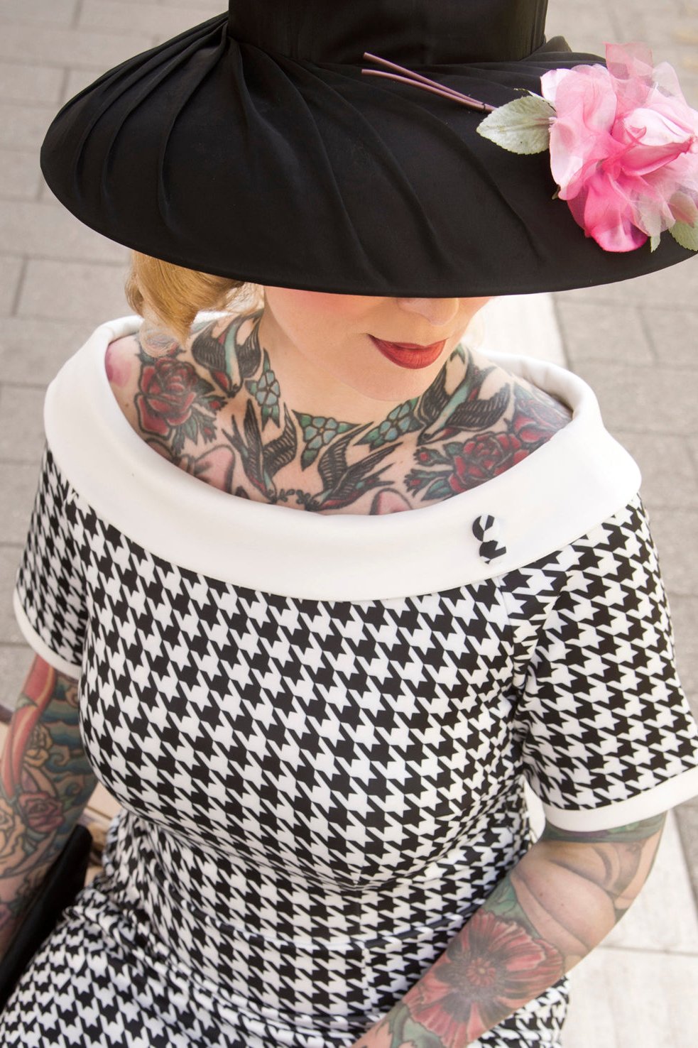 A model wearing a Houndstooth Fitted Off Shoulder Dress