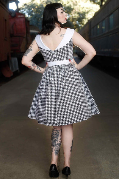 Back view of model wearing Houndstooth Roll Collar Dress