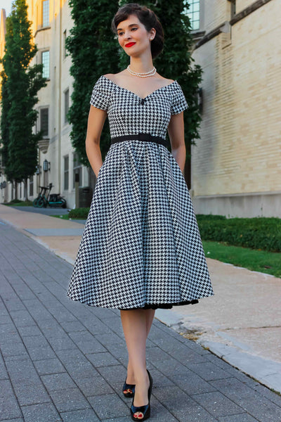 A model wearing a Houndstooth Sleeved Full Circle Dress in Black/White