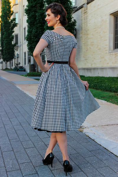 A model wearing a Houndstooth Sleeved Full Circle Dress in Black/White