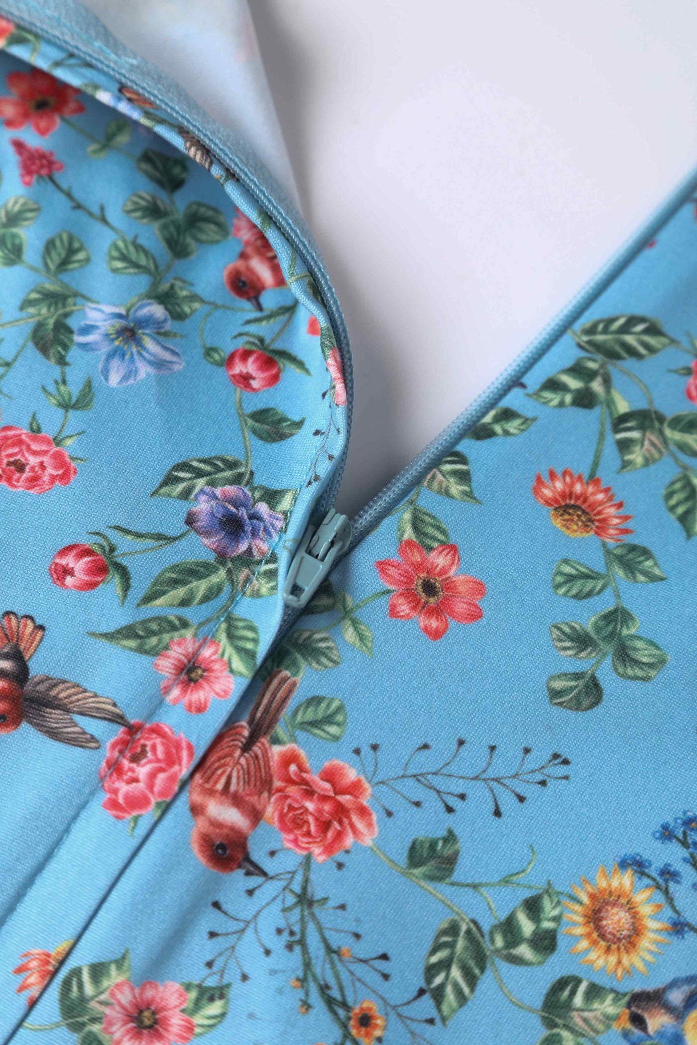 Close up view of Hummingbird Print Long Sleeved Dress in Blue
