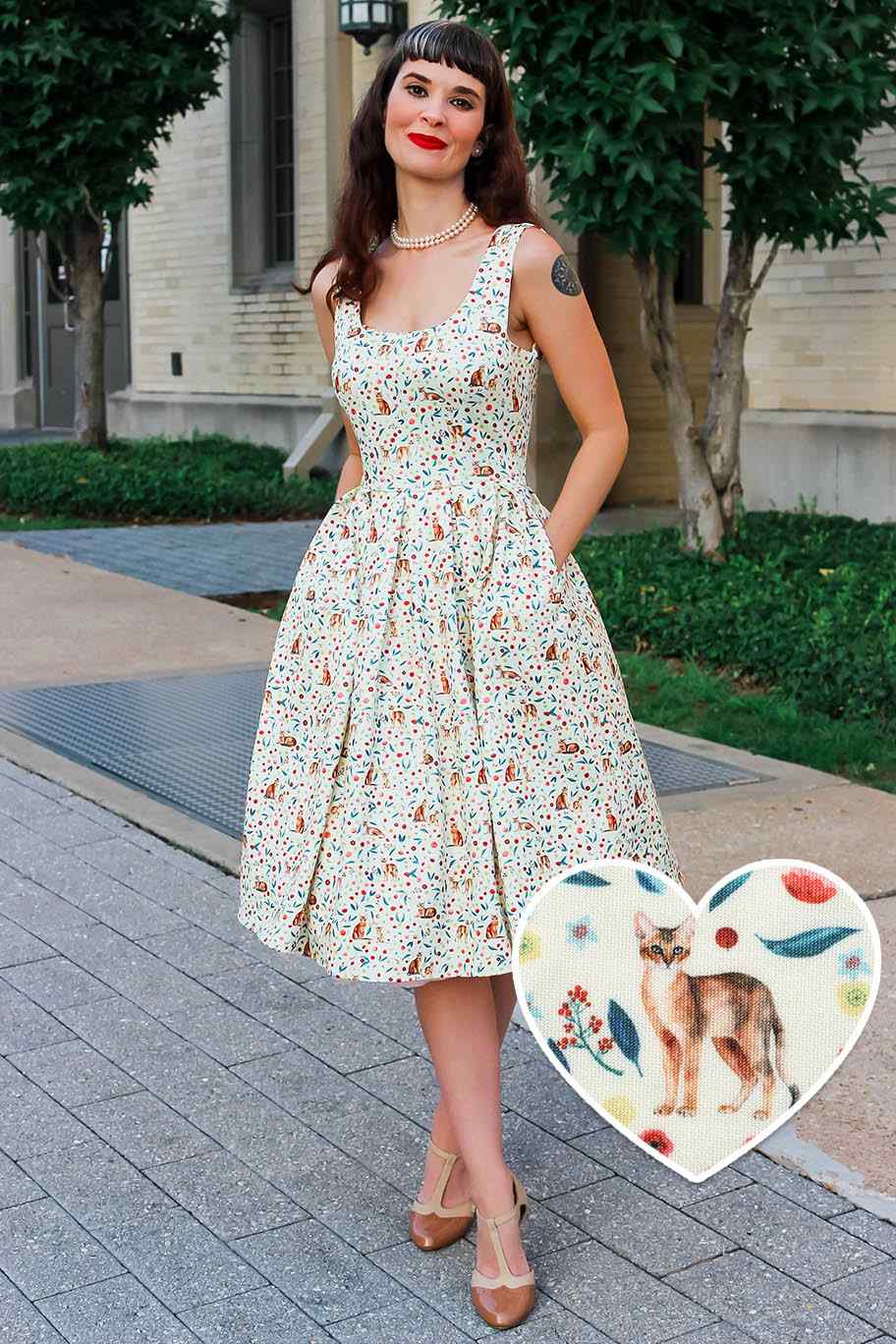 A model wearing Ivory Cream Flared Dress in Cat Floral Print