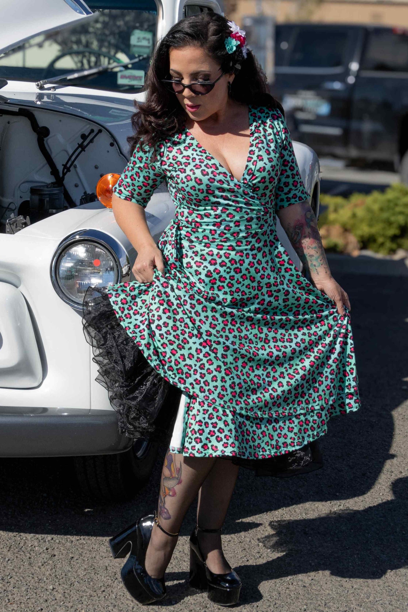 A lady wearing  a Leopard Print Wrap Dress In Green