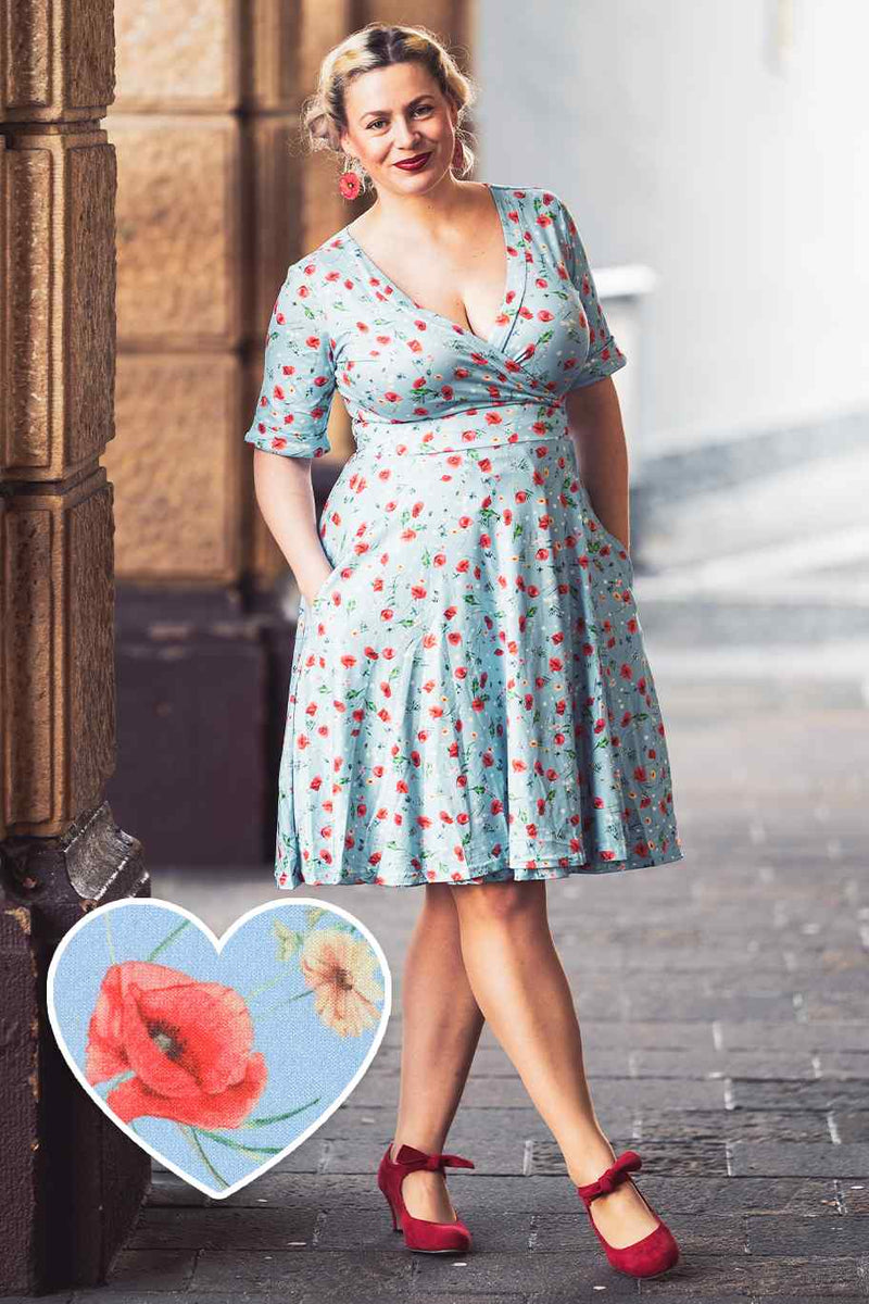 A model wearing a Light Blue Poppy Wrap Dress