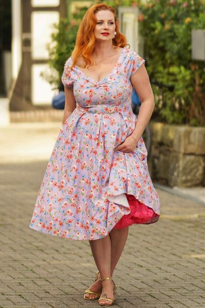 A model wearing a  Lilac Watercolour Floral Off Shoulder Dress