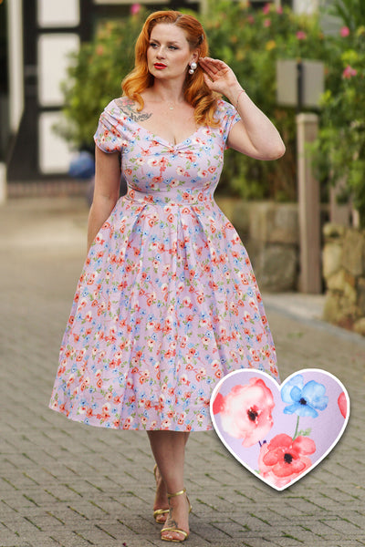 A model wearing a  Lilac Watercolour Floral Off Shoulder Dress