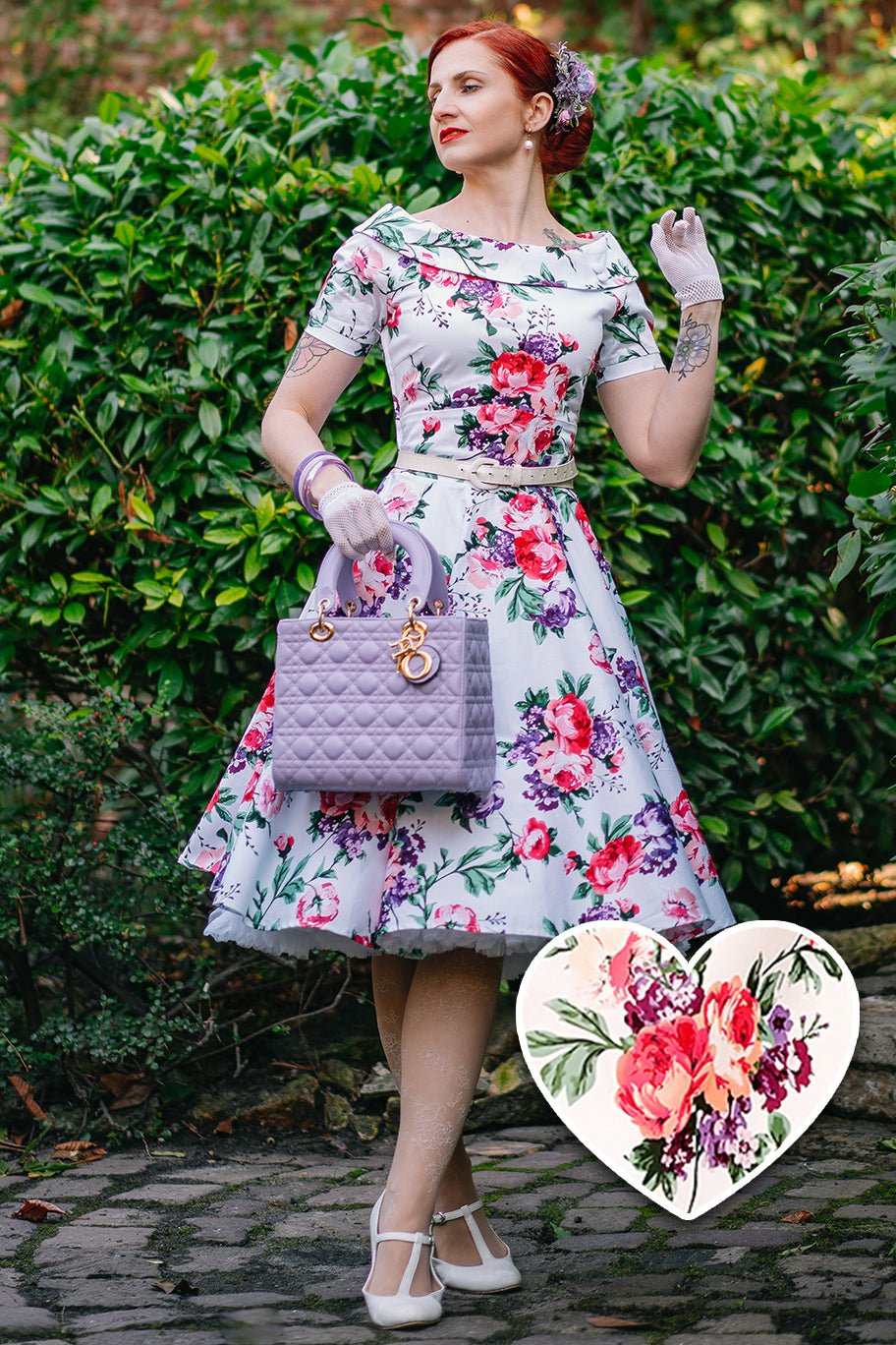 Woman wearing our Darlene Retro Floral Swing Dress in White