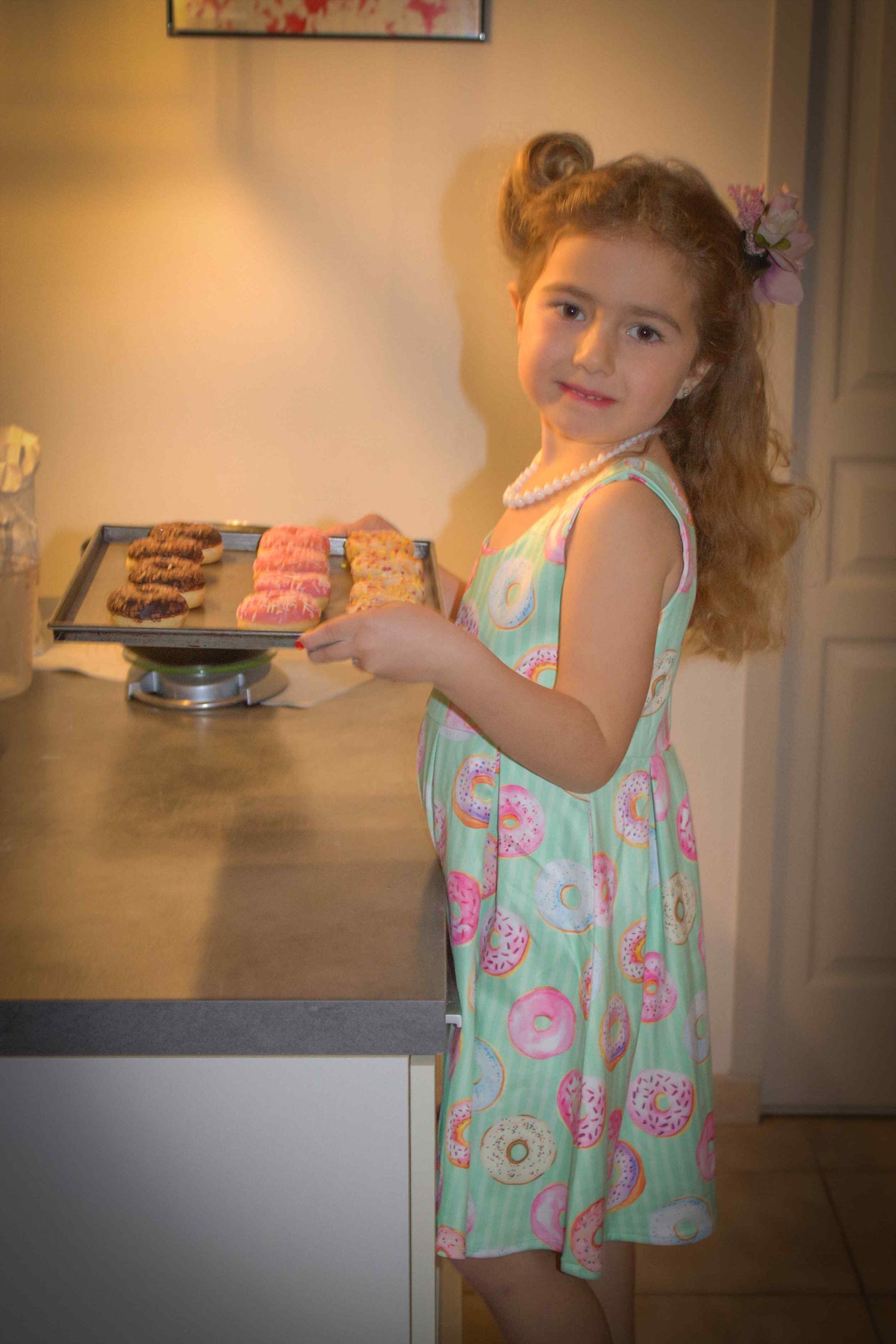 A cute child wearing Mint Donut Tea Dress