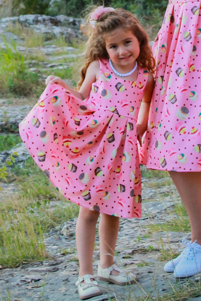 A model wearing amanda-pink-cupcake-swing-dress