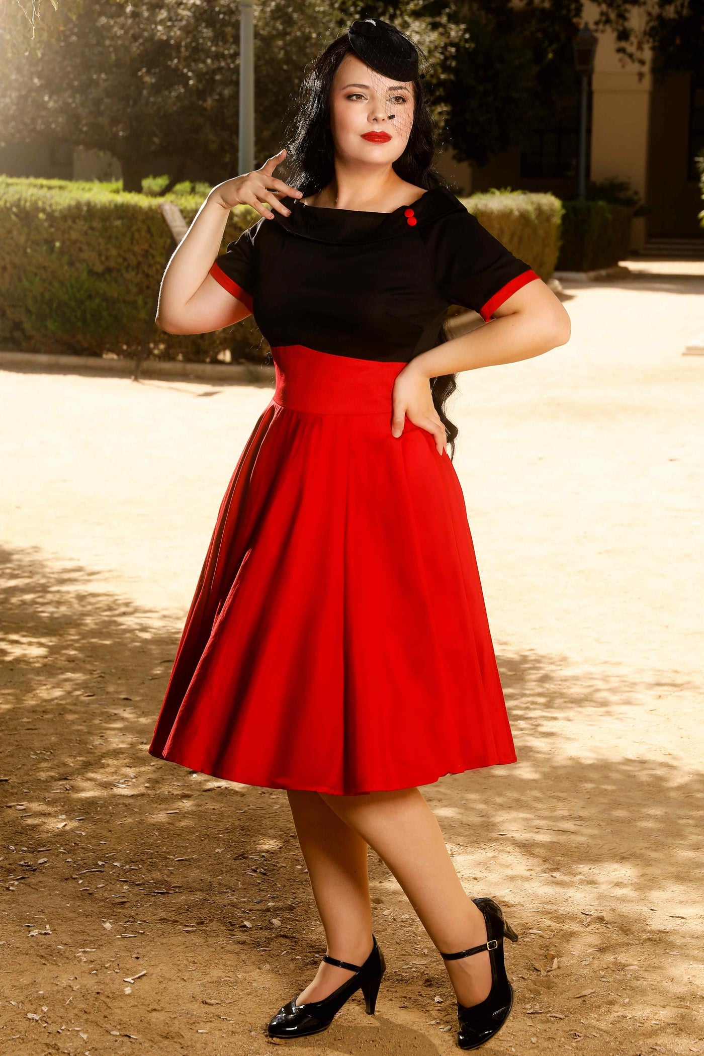 A model wearing a Navy & Burgundy Swing Dress