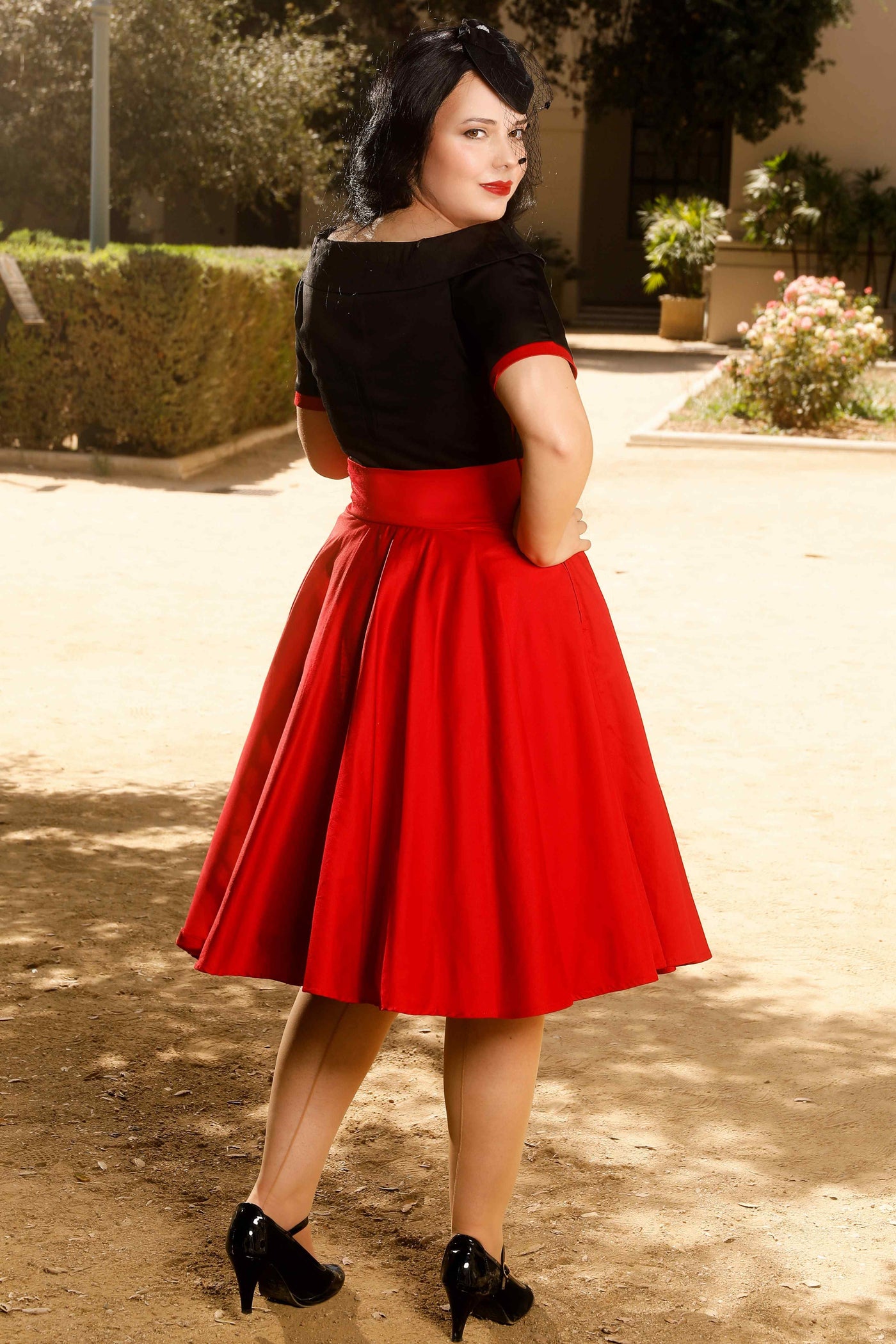 A model wearing a Navy & Burgundy Swing Dress