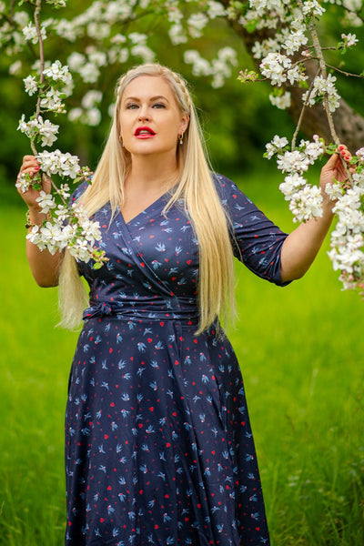 Model wearing a Navy Blue Heart & Swallow Wrap Dress