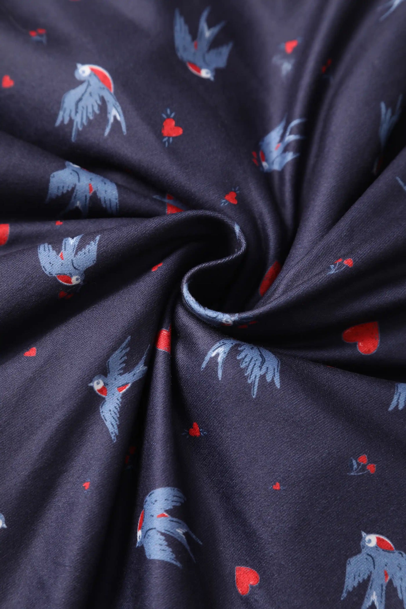 Close up view of Navy Blue Heart & Swallow Wrap Dress