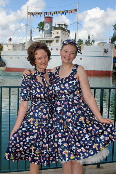 Models wearing Navy Blue Wonderland Swing Dress and headband