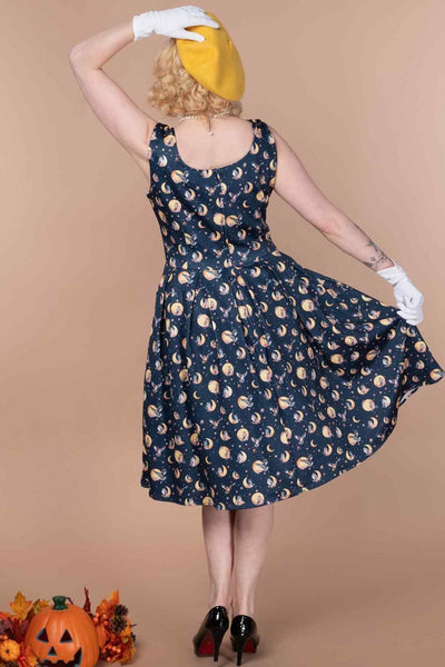 A model wearing a Navy Blue Night Owl Swing Dress