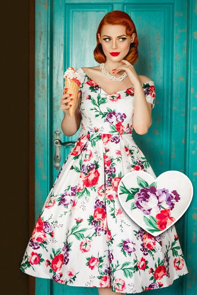 Model wearing our Lily, off-shoulder 50's Evening Dress in White, with pink and purple flowers