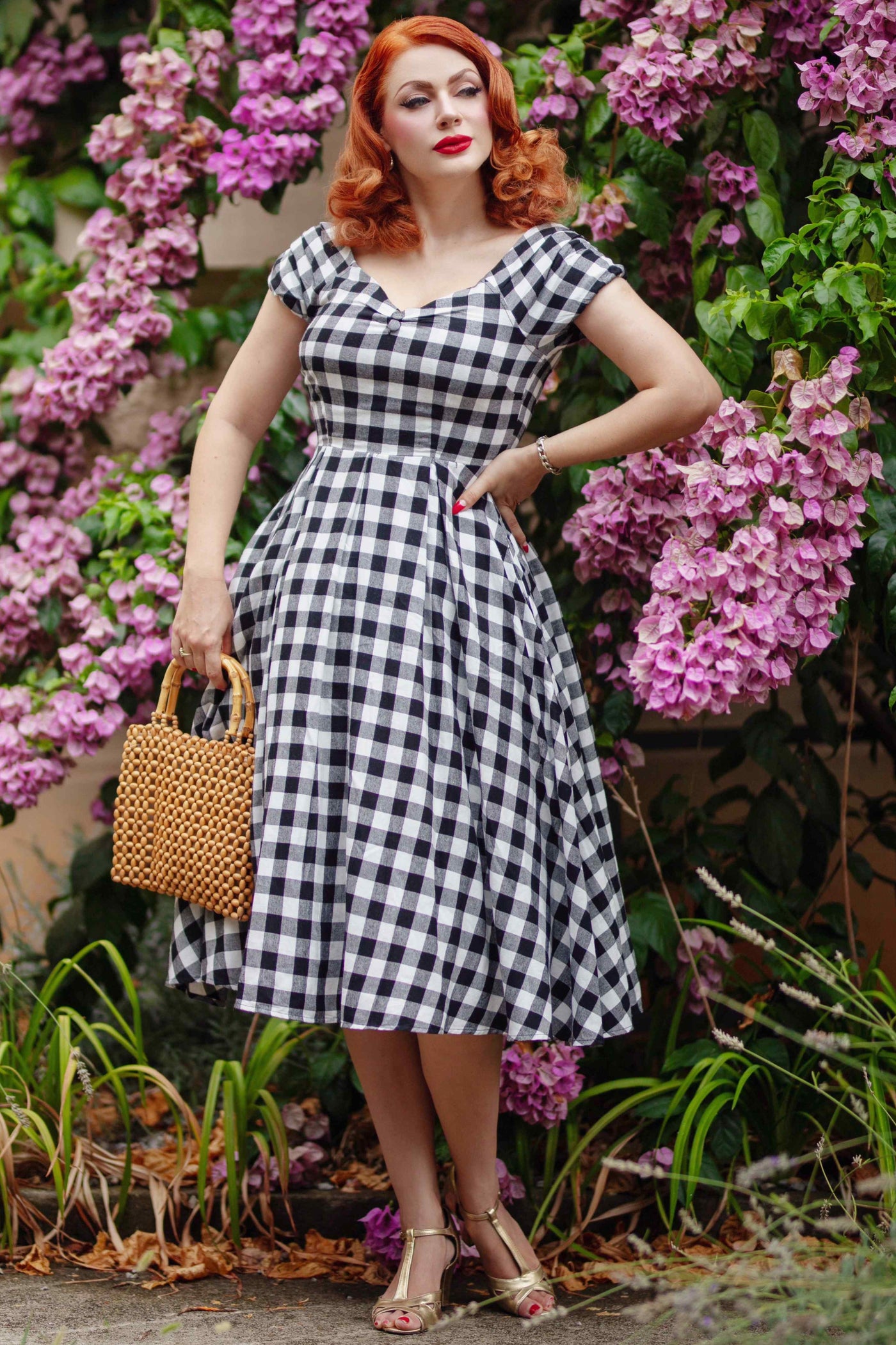 A model wearing an Off Shoulder Black Gingham Check Circle Dress