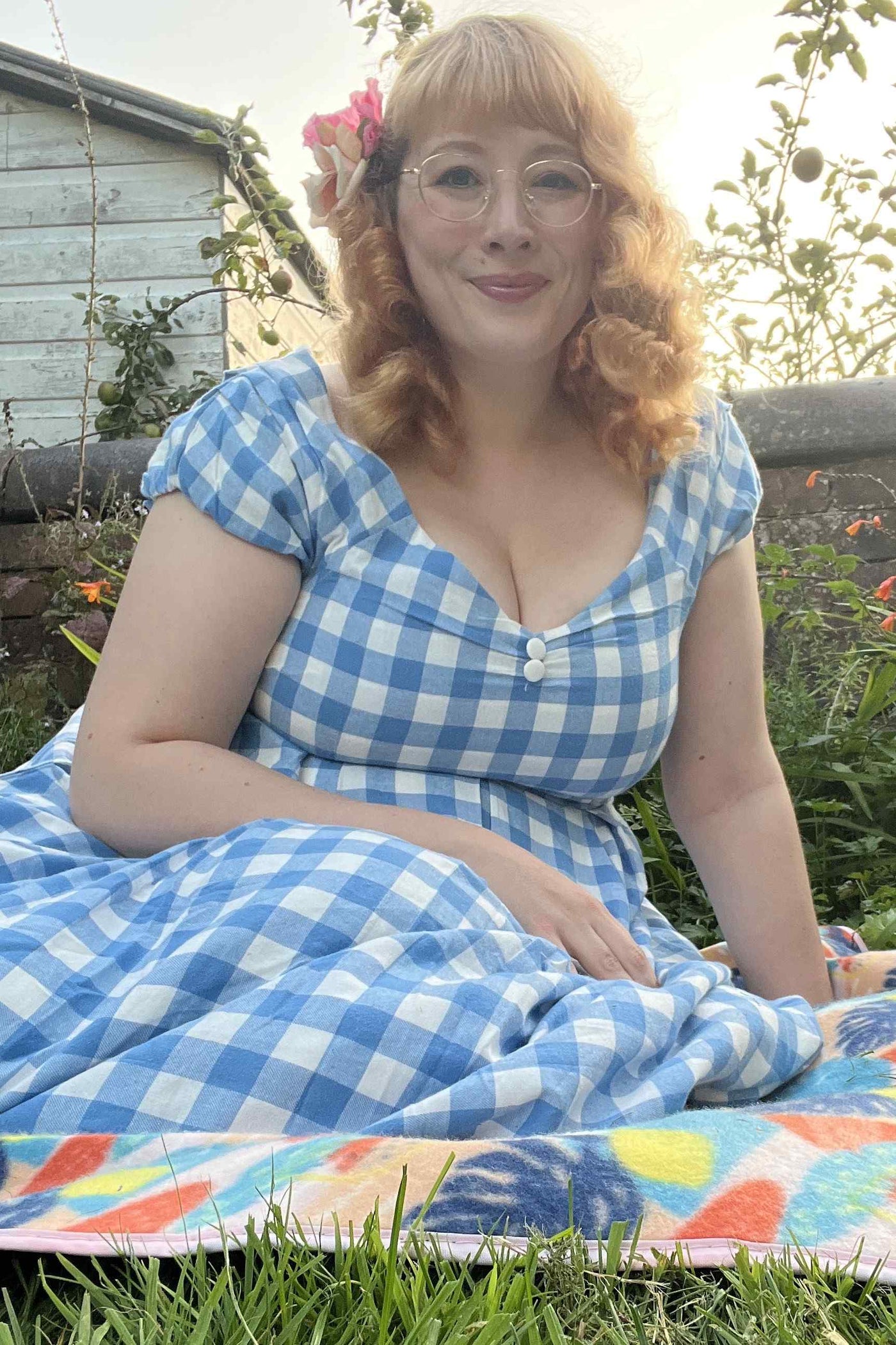 A model wearing  an Off Shoulder Blue Gingham Dress