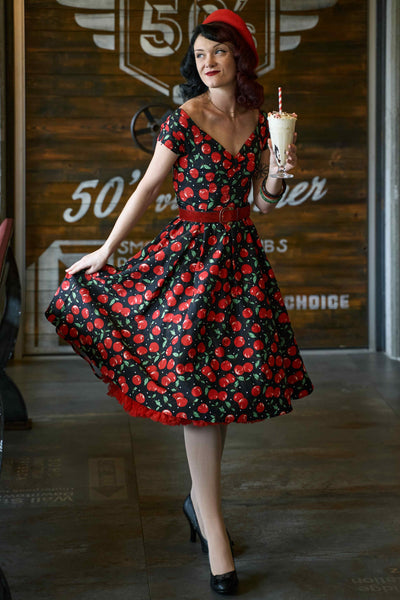 A model wearing a Off Shoulder Cherry Swing Dress