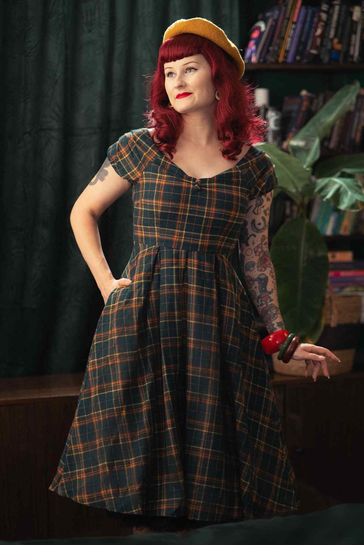 A model wearing an Off Shoulder Green Tartan Check Circle Dress