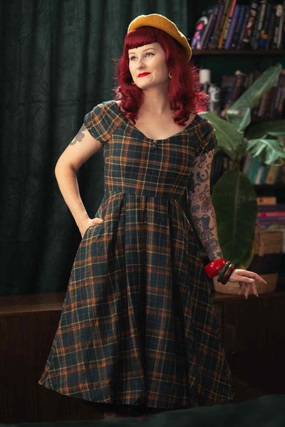 A model wearing an Off Shoulder Green Tartan Check Circle Dress