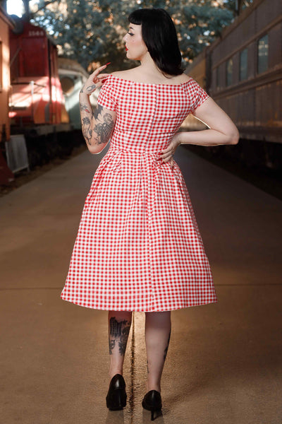 Back view of model wearing Off Shoulder Red Gingham Swing Dress