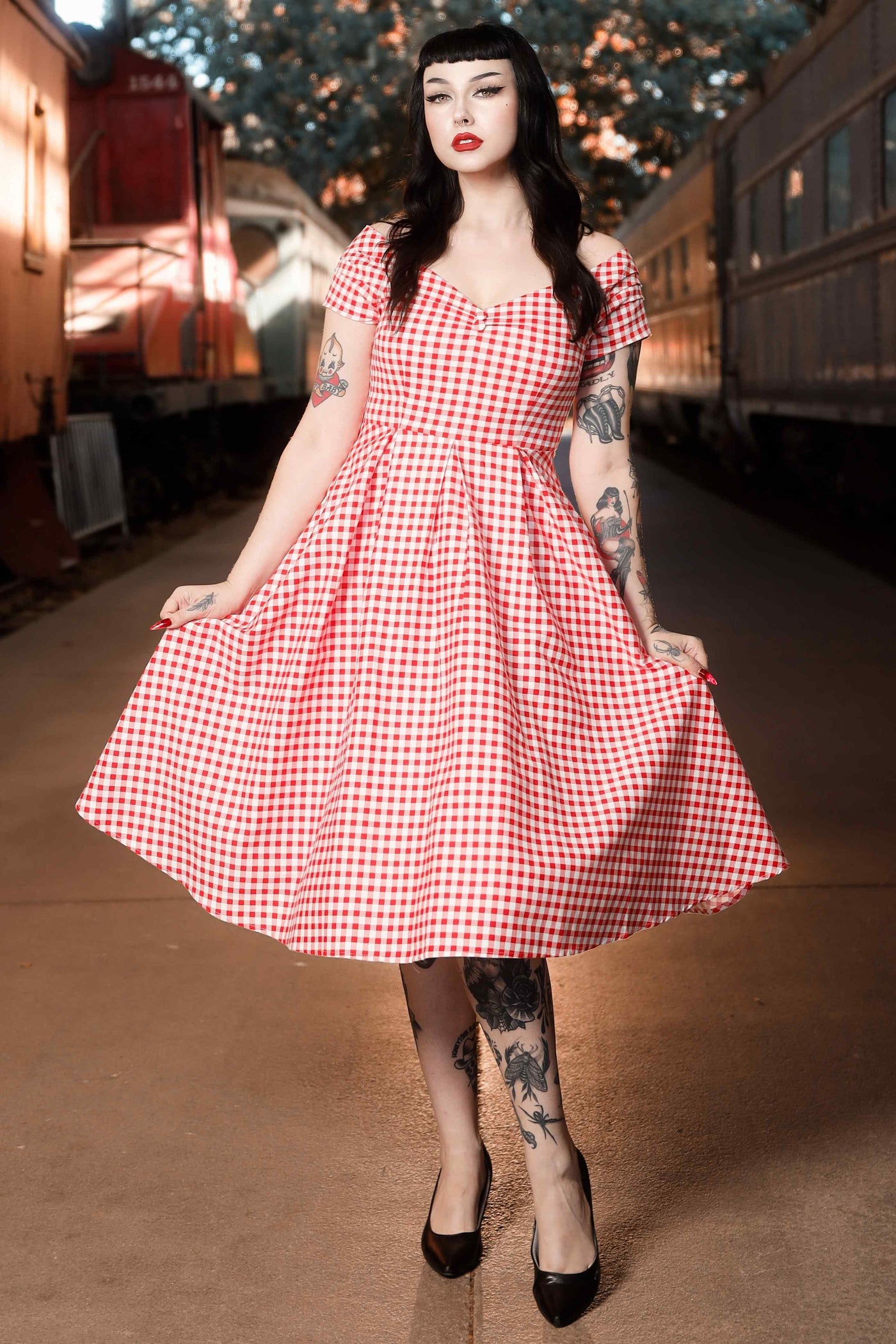 Front view of model wearing Off Shoulder Red Gingham Swing Dress