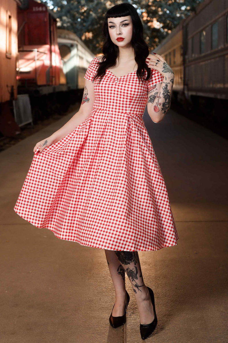 A model wearing Off Shoulder Red Gingham Swing Dress