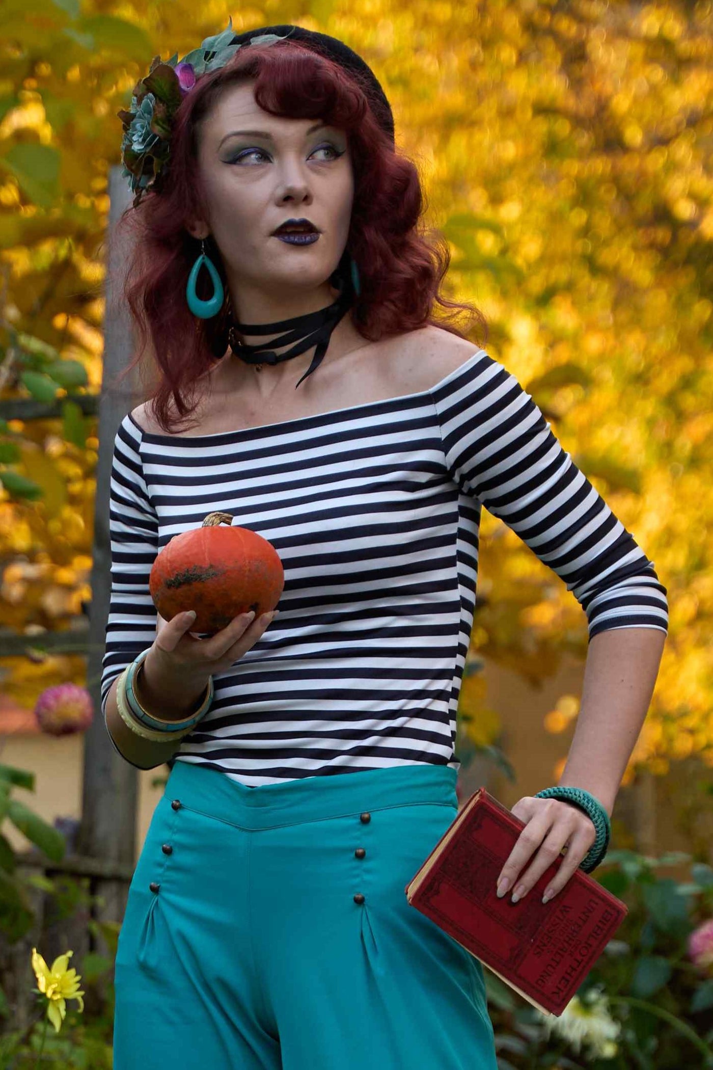 A lady wearing an Off Shoulder Retro Striped Top in Black