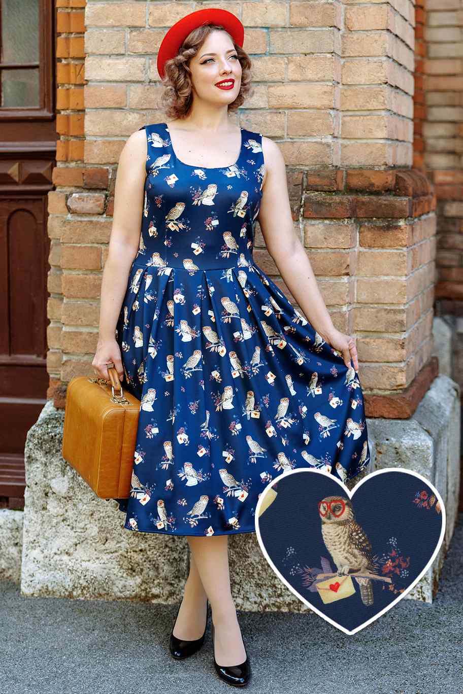 A lady wearing a Owl & Letter Swing Dress in Dark Blue